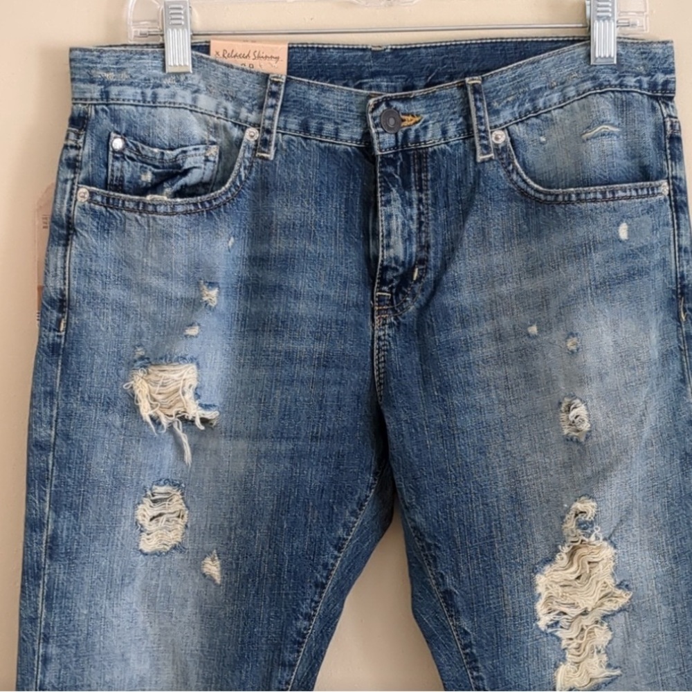 Distressed Blue Denim Jeans